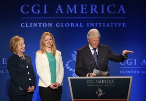 Bill, Hillary and Chelsea trying not to care about money.